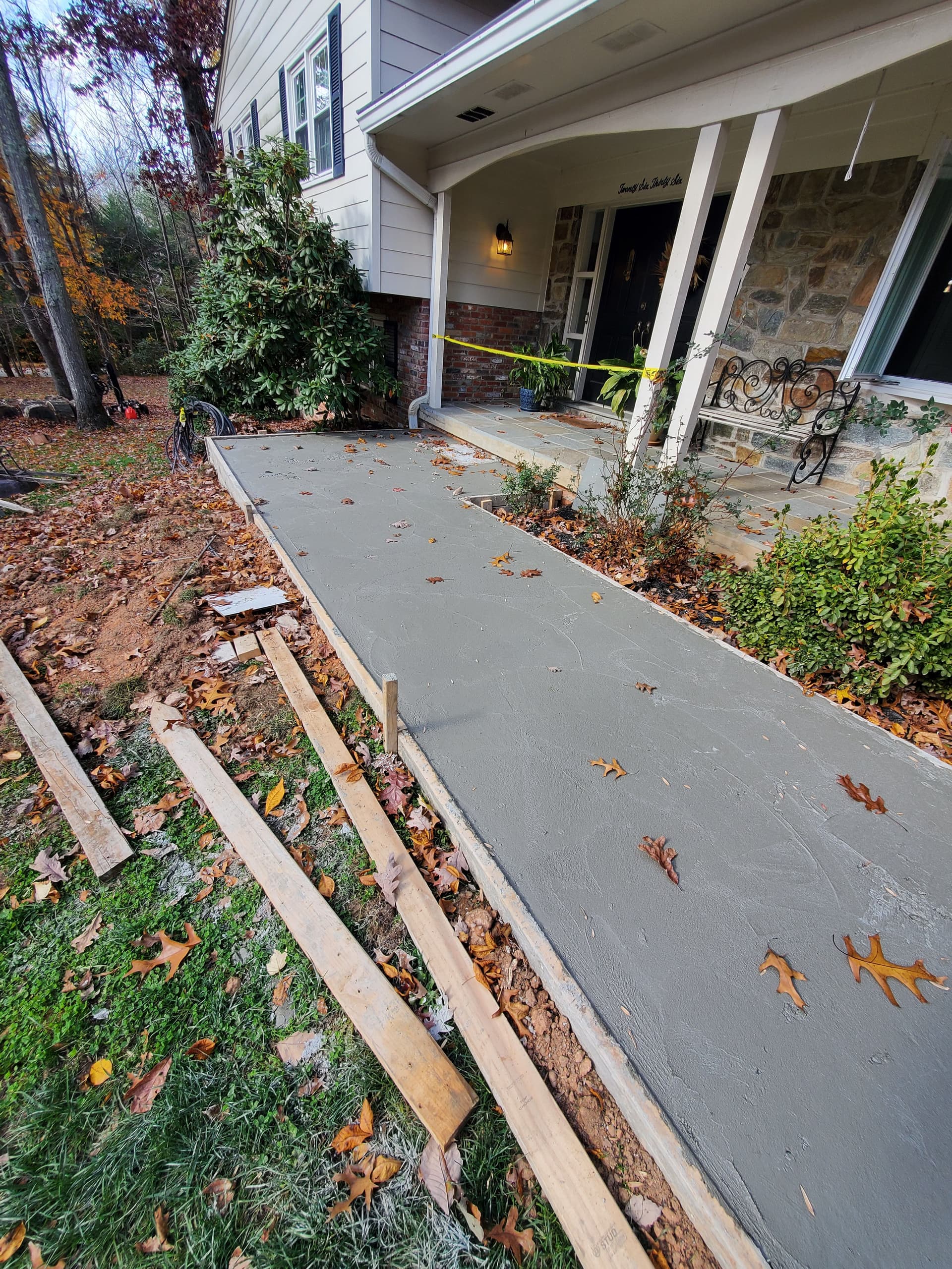 Gallery photos for Cracked Sidewalk Gone - Stamped Patio and Stone Wall Built Right: Image #3