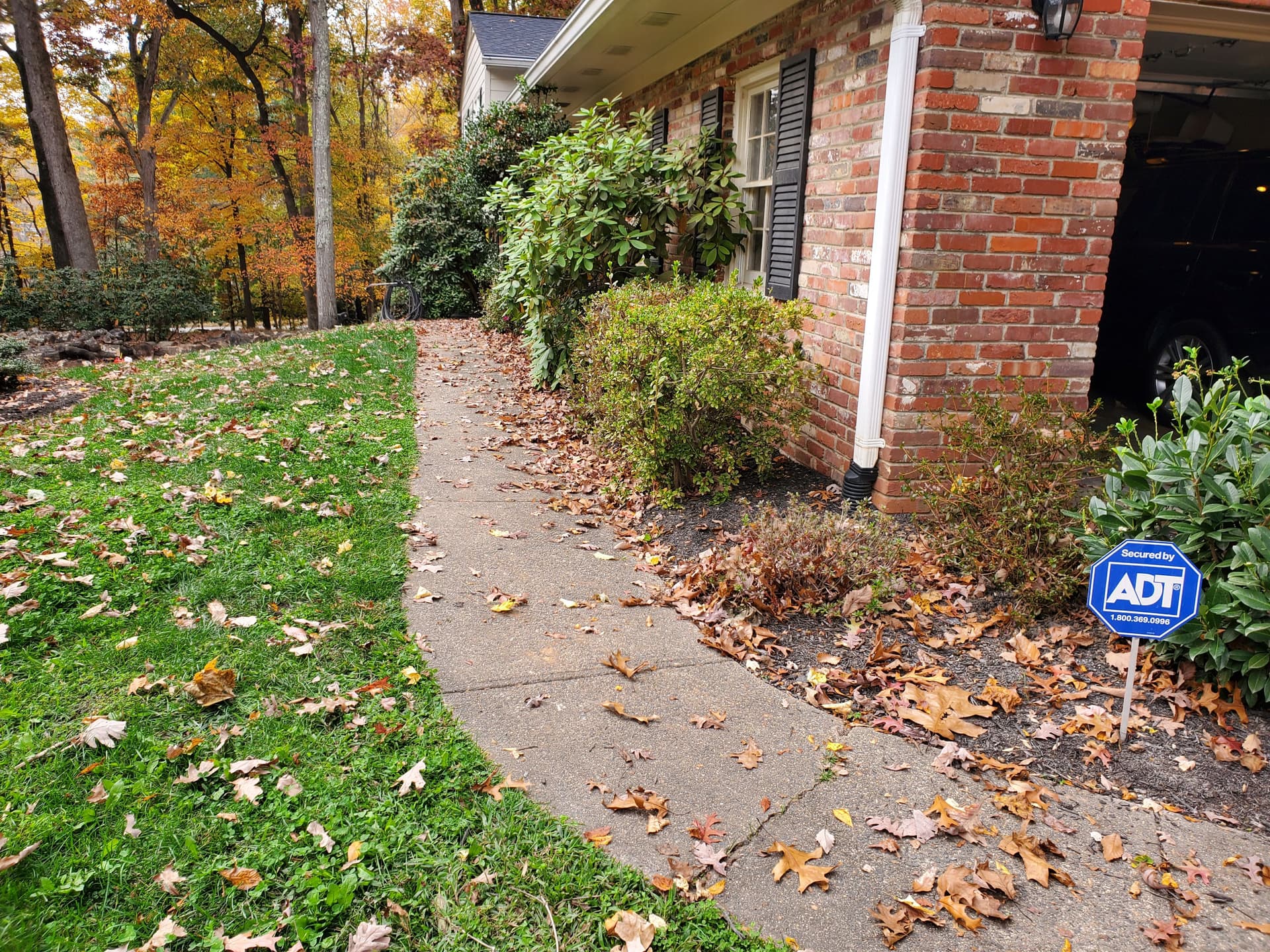 Cracked Sidewalk Gone - Stamped Patio and Stone Wall Built Right image