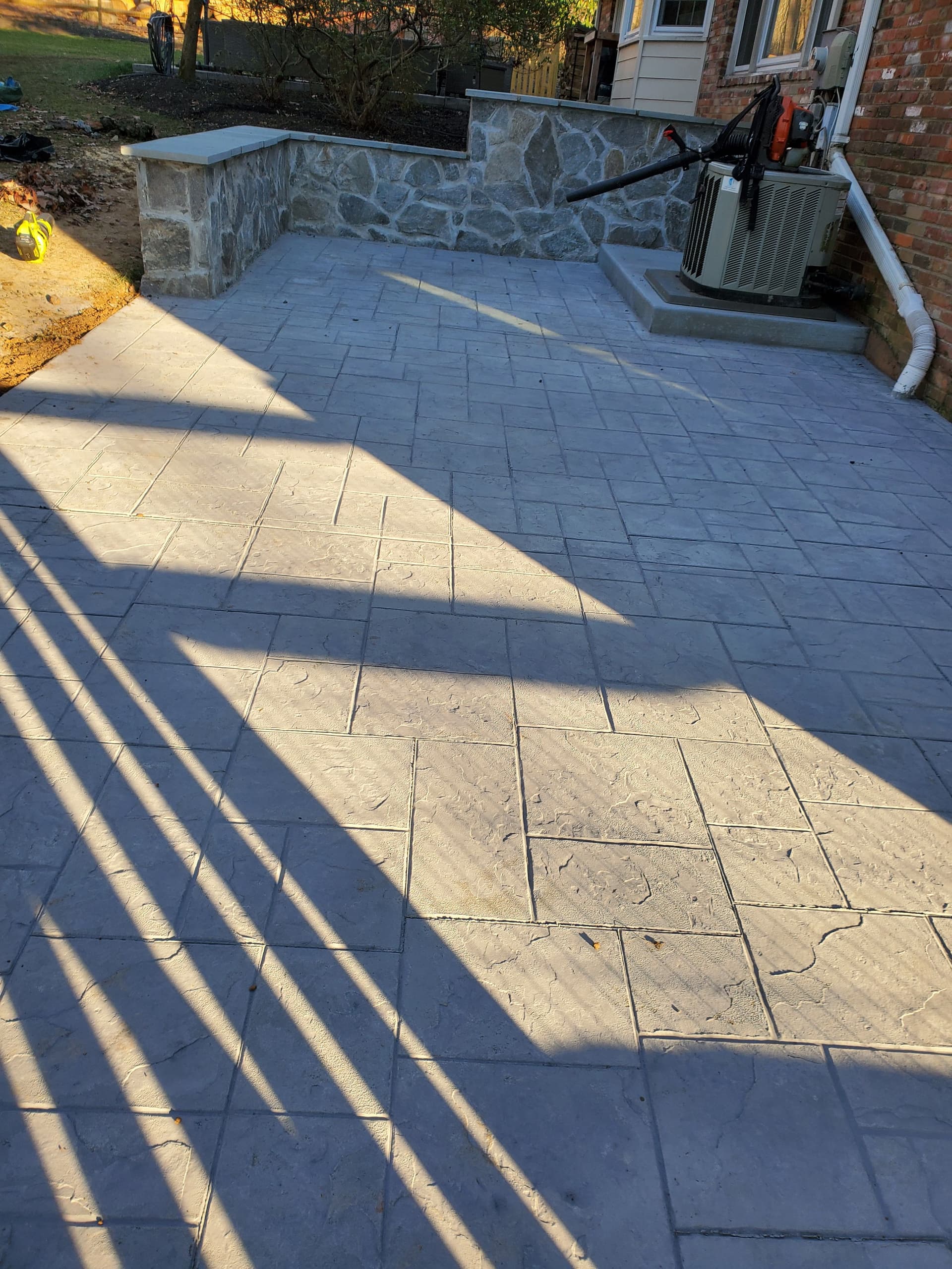 Gallery photos for Cracked Sidewalk Gone - Stamped Patio and Stone Wall Built Right: Image #7