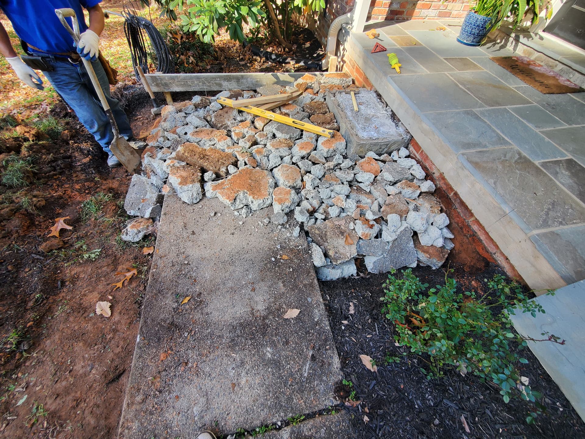 Gallery photos for Cracked Sidewalk Gone - Stamped Patio and Stone Wall Built Right: Image #1