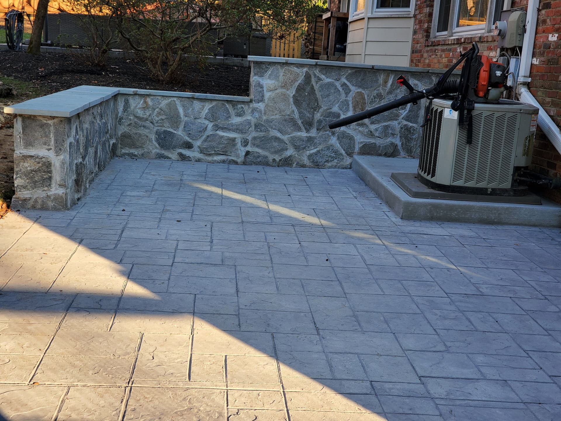 Gallery photos for Cracked Sidewalk Gone - Stamped Patio and Stone Wall Built Right: Image #8
